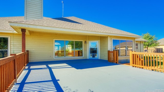 rear view of property with a deck