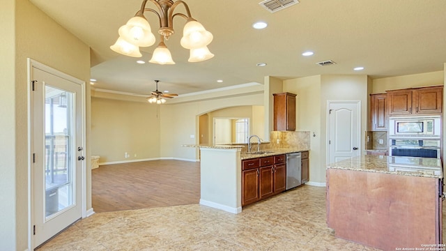 kitchen with decorative backsplash, plenty of natural light, light hardwood / wood-style floors, and appliances with stainless steel finishes