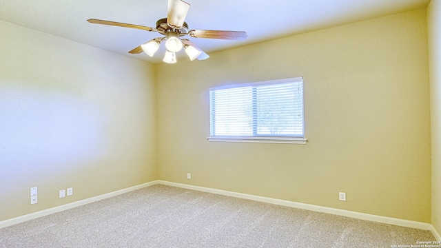 spare room featuring carpet flooring and ceiling fan