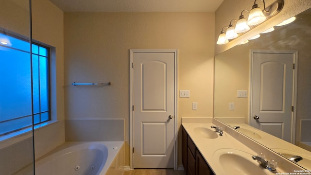 bathroom featuring vanity and a bath