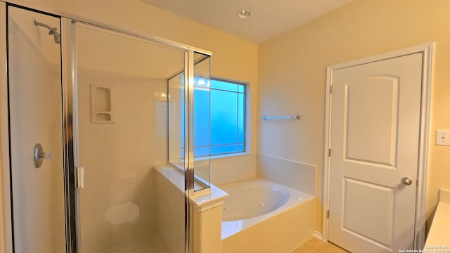 bathroom with tile patterned floors and independent shower and bath