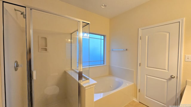 9019 Mimosa Mnr, San Antonio, TX 78245 - bathroom featuring a stall shower, a bath, and tile patterned flooring
