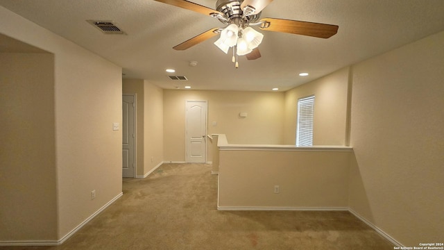 9019 Mimosa Mnr, San Antonio, TX 78245 - carpeted empty room with a ceiling fan and recessed lighting