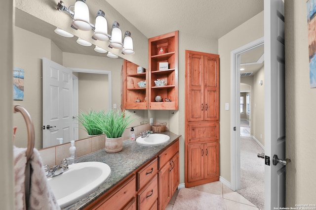 bathroom featuring vanity and a textured ceiling