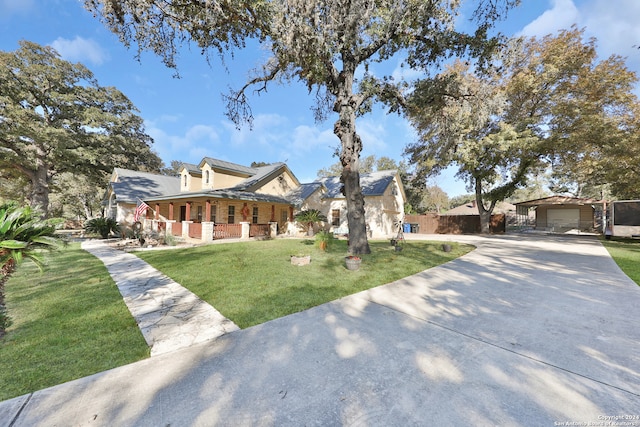 view of front of house with a front yard and covered porch