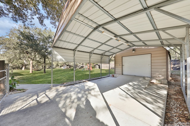 garage with a yard and a carport