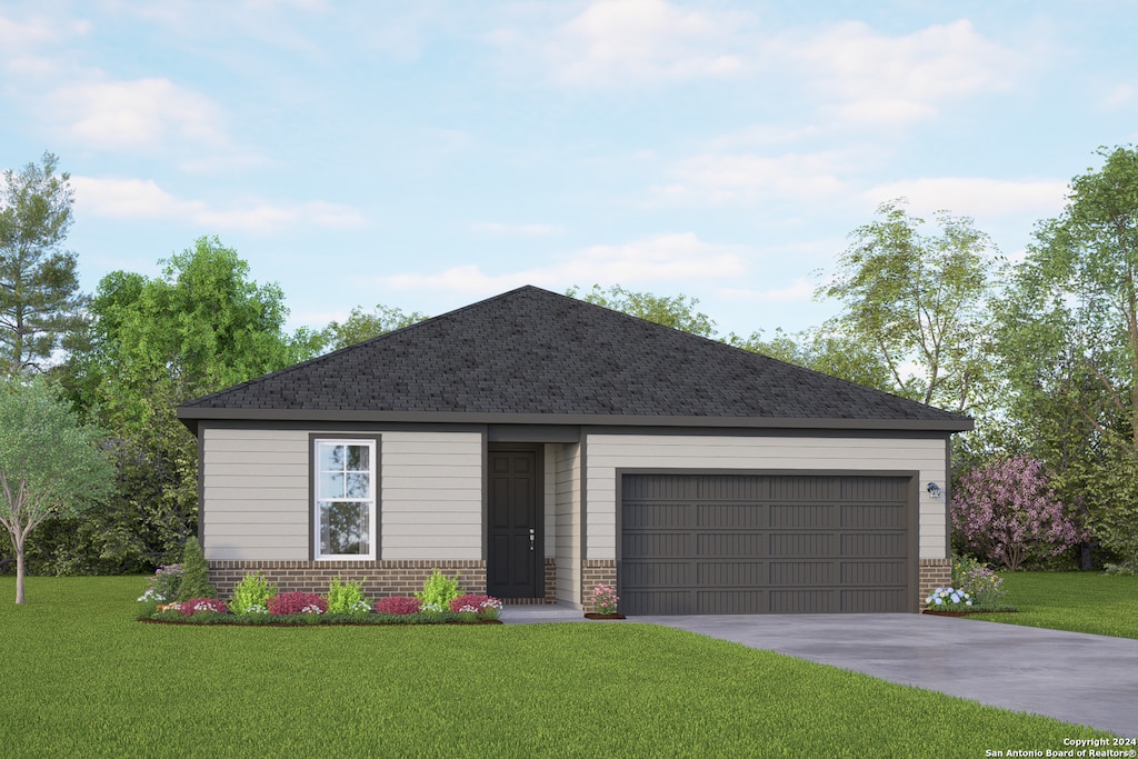 view of front facade with a front yard and a garage