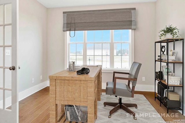 2830 Sueno Pt, San Antonio, TX 78245 - office area featuring baseboards and wood finished floors