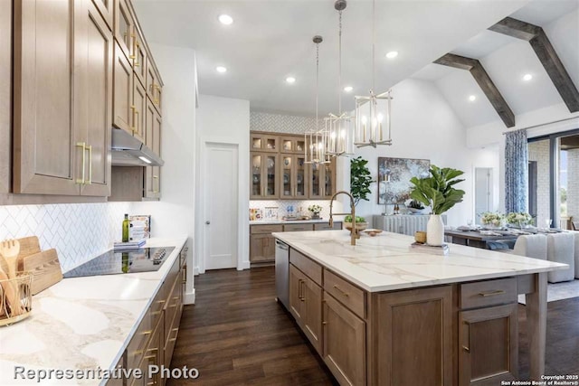 kitchen with tasteful backsplash, pendant lighting, beamed ceiling, and a large island