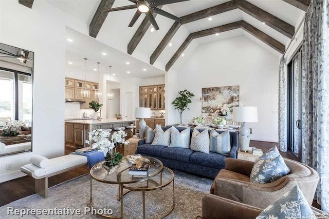 living room featuring dark hardwood / wood-style floors, high vaulted ceiling, and beam ceiling