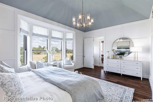 bedroom with vaulted ceiling, a notable chandelier, and dark hardwood / wood-style flooring