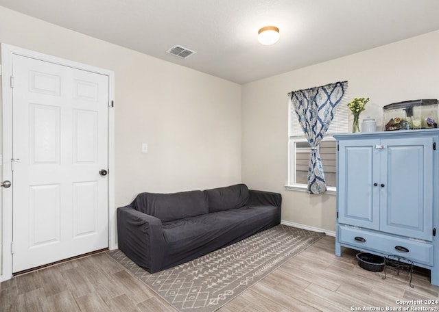 living area with light hardwood / wood-style floors