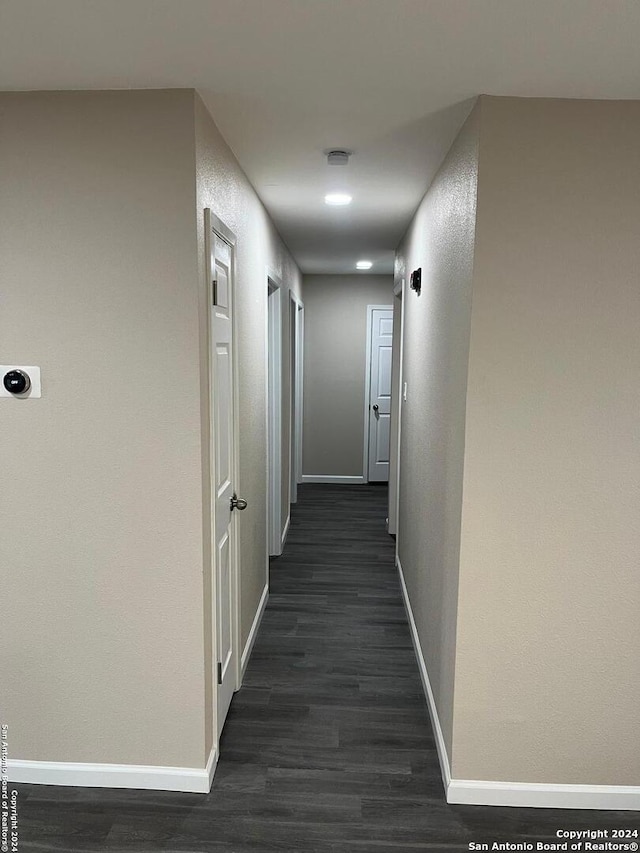 811 Thrasher Dr, San Antonio, TX 78245 - hall with baseboards and dark wood-style floors