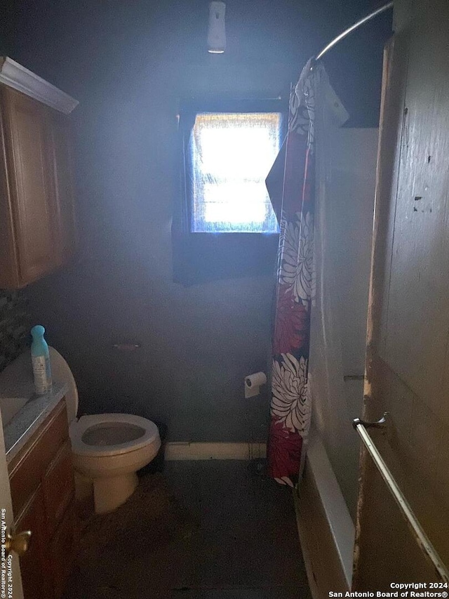 bathroom with shower / tub combo and toilet