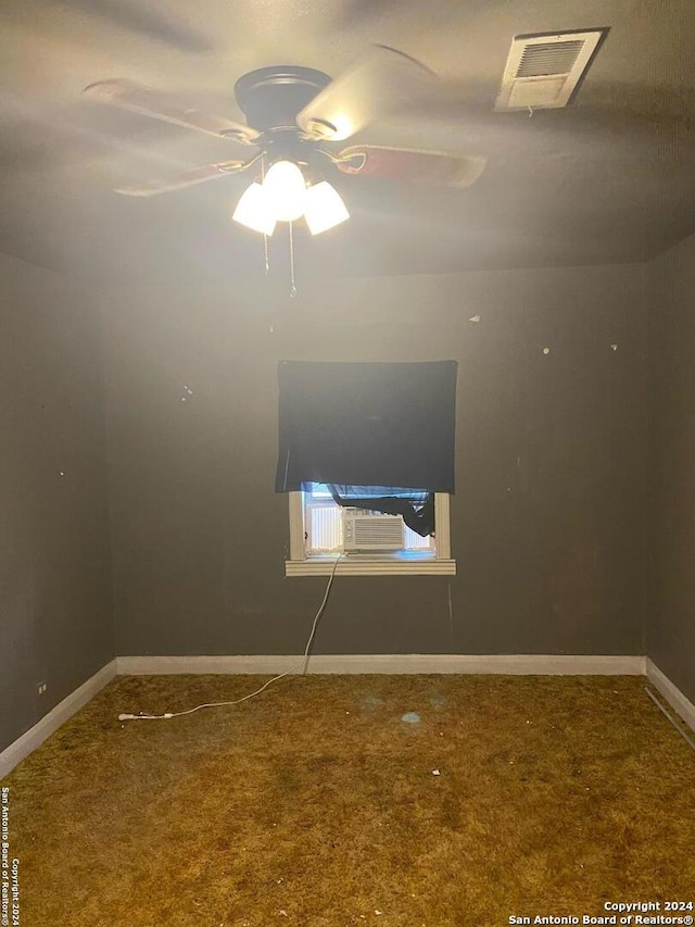 carpeted empty room with ceiling fan and cooling unit