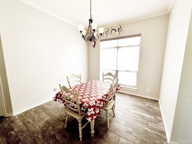 dining room with an inviting chandelier, dark wood-type flooring, and ornamental molding