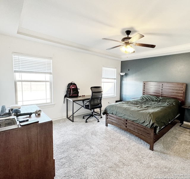 carpeted bedroom featuring ceiling fan and crown molding