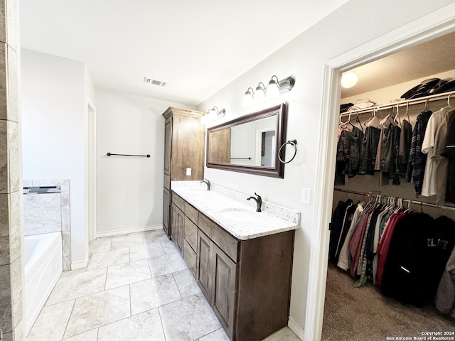 bathroom with a bathing tub and vanity