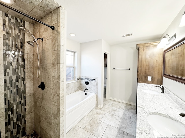 full bathroom with vanity, independent shower and bath, and toilet