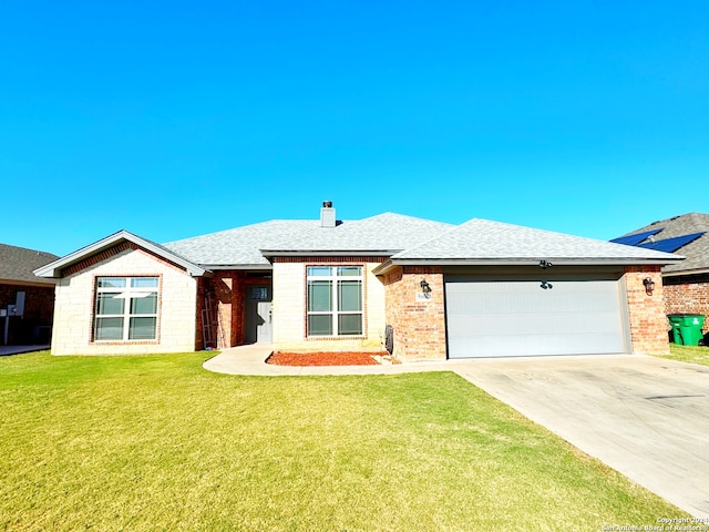 ranch-style home featuring a garage and a front lawn