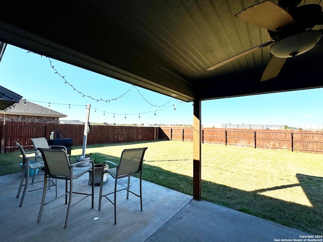 view of patio featuring ceiling fan