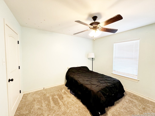 carpeted bedroom featuring ceiling fan