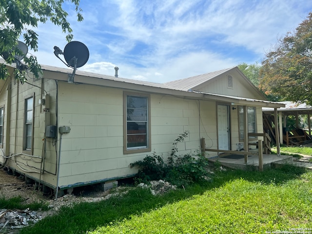 rear view of house with a lawn