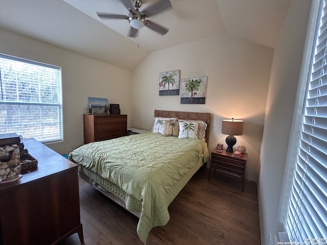 bedroom with ceiling fan, dark hardwood / wood-style flooring, and vaulted ceiling