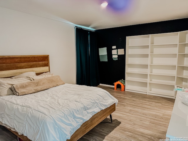 bedroom featuring hardwood / wood-style floors