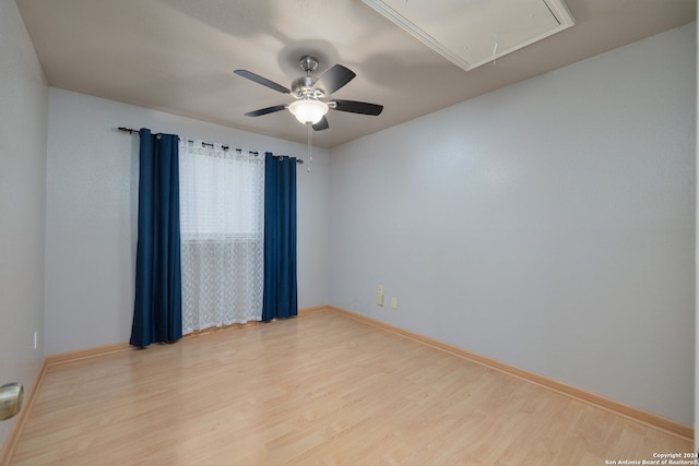 empty room with light hardwood / wood-style floors and ceiling fan