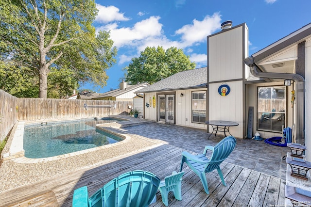 view of pool with a wooden deck