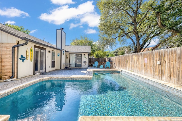 view of swimming pool featuring a patio area