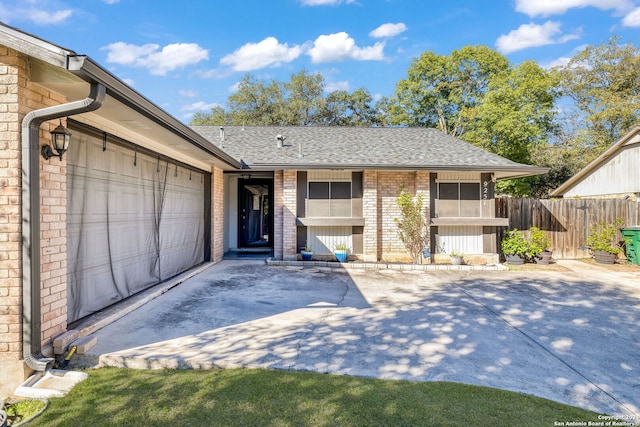 single story home featuring a garage