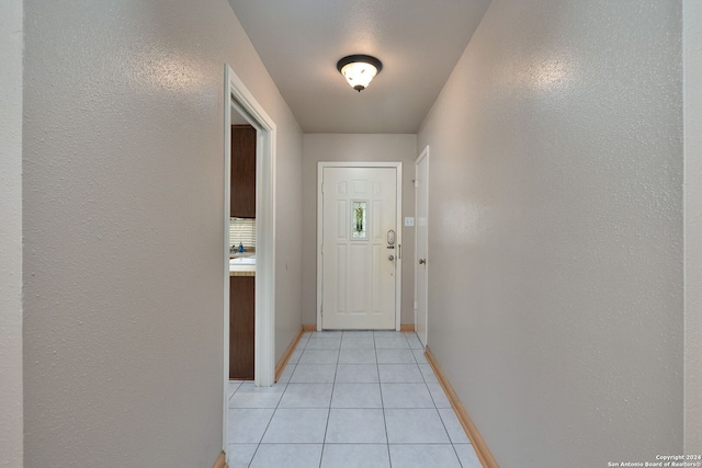 entryway with light tile patterned floors