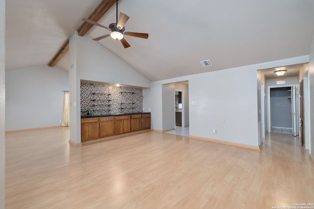 unfurnished living room with beamed ceiling, ceiling fan, high vaulted ceiling, and light hardwood / wood-style flooring