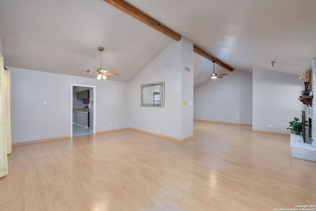 unfurnished living room with a fireplace, vaulted ceiling with beams, light hardwood / wood-style floors, and ceiling fan