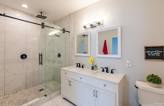 802 Piedmont Ave, San Antonio, TX 78210 - bathroom featuring toilet, a stall shower, double vanity, and recessed lighting