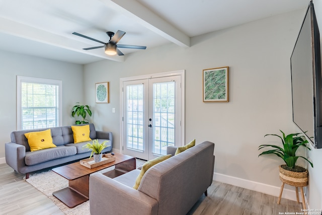 living room featuring french doors, light hardwood / wood-style floors, ceiling fan, and beam ceiling