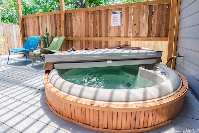 exterior space featuring a covered hot tub