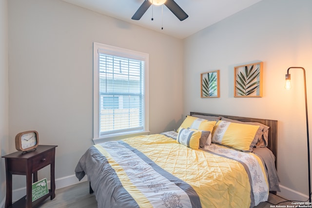 bedroom featuring hardwood / wood-style floors and ceiling fan