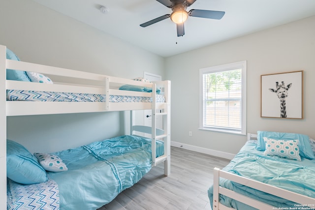 bedroom with light wood-type flooring and ceiling fan