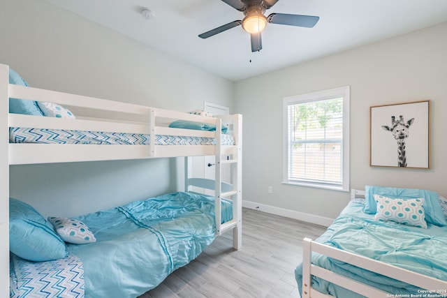 802 Piedmont Ave, San Antonio, TX 78210 - bedroom with baseboards and wood finished floors