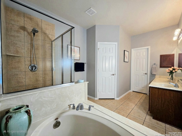 bathroom featuring vanity, tile patterned flooring, and plus walk in shower