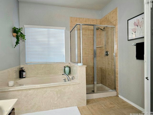 bathroom with tile patterned floors, vanity, and plus walk in shower