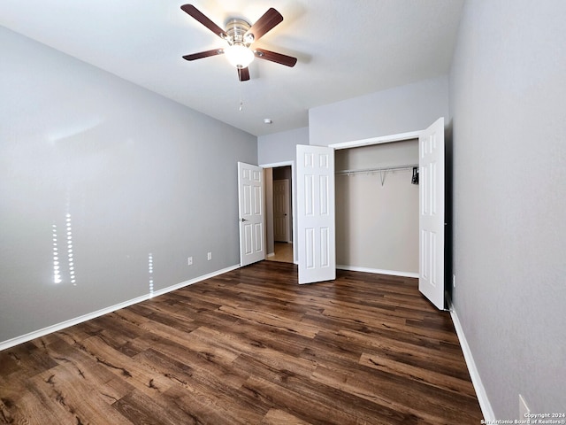 unfurnished bedroom featuring a closet, ceiling fan, and dark hardwood / wood-style flooring