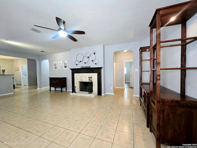 tiled living room featuring ceiling fan