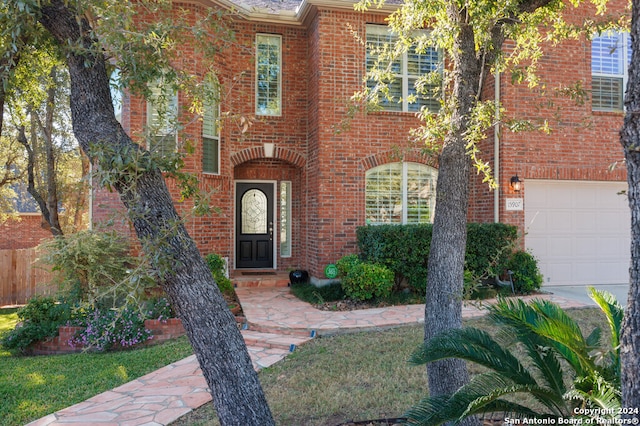 view of exterior entry featuring a garage