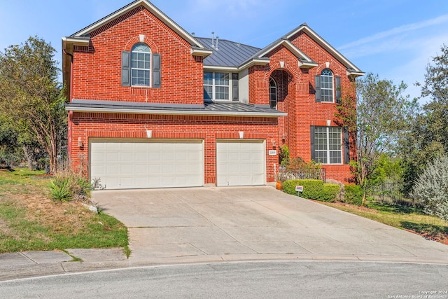 front facade with a garage