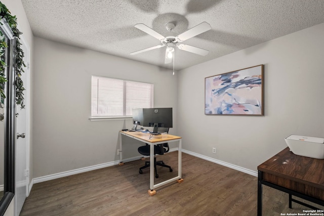 office with a textured ceiling, ceiling fan, and dark hardwood / wood-style floors