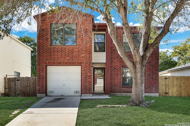 view of front facade featuring a garage and a front lawn